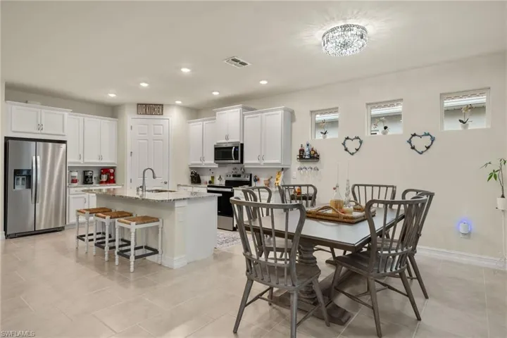 Tiled dining space with sink