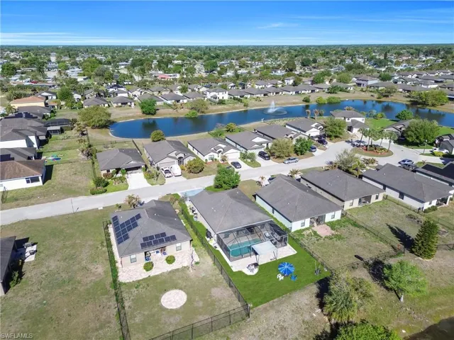 Aerial perspective of suburban area with a large body of water