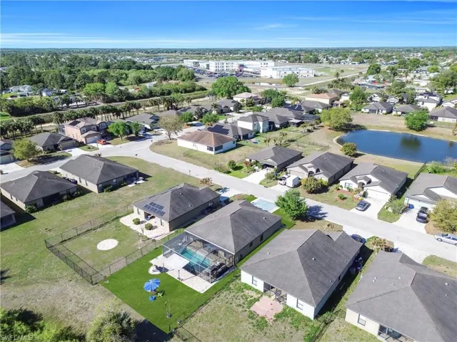 Aerial view of residential area featuring a large body of water