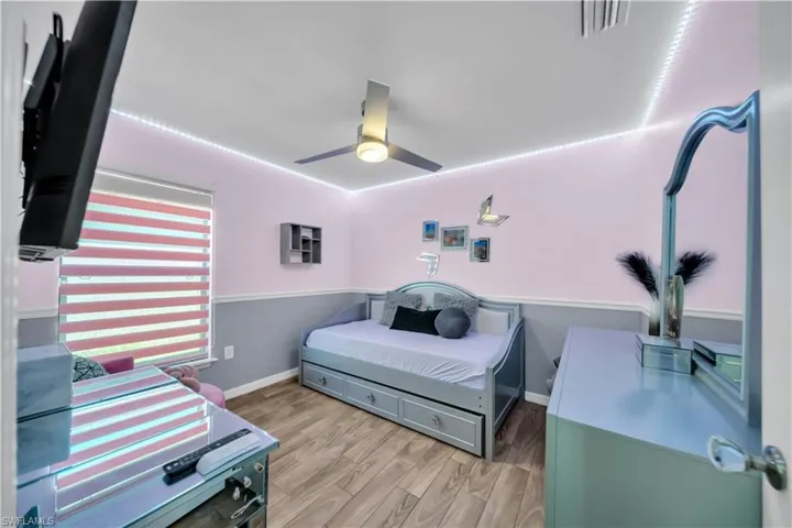 Bedroom featuring light wood-style floors and ceiling fan