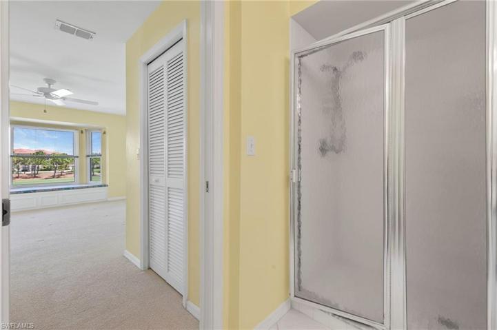 walk in shower and his and hers big closets