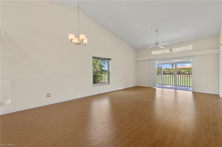 Living/Dining area with light floors& tall ceilings
