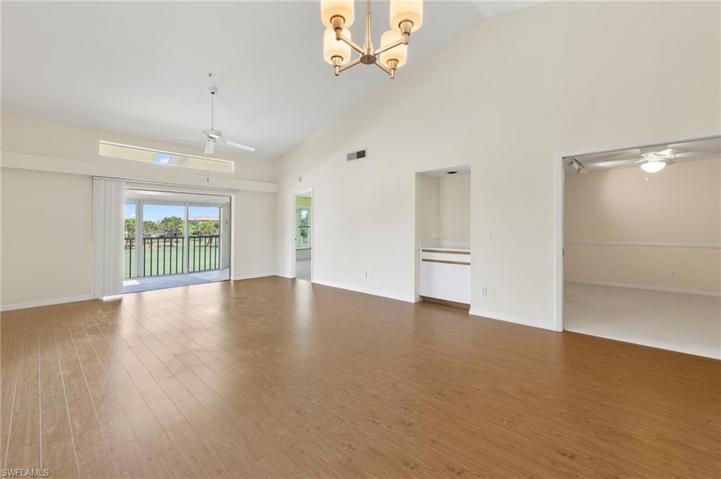 Living/Dining area with light floors and tall ceilings