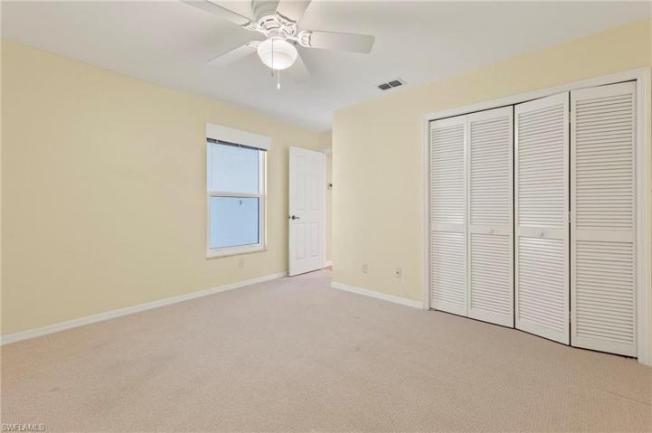 guest bedroom with spacious closet window