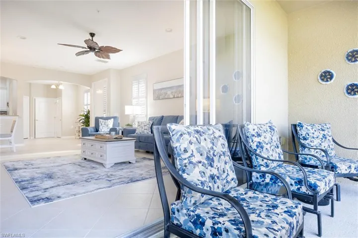 View of patio featuring ceiling fan