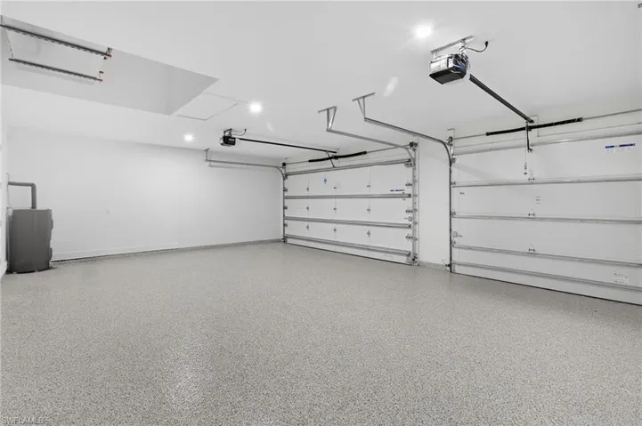 Garage featuring a garage door opener