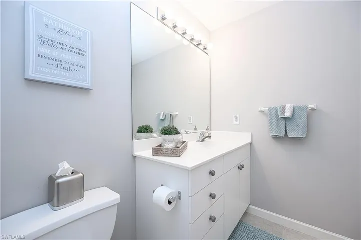 Bathroom with tile patterned flooring, vanity, and toilet