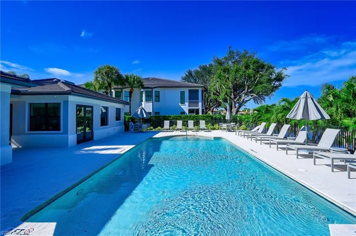 View of swimming pool with a patio area