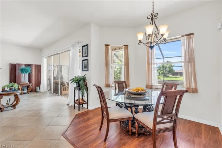 Tiled dining area with a notable chandelier