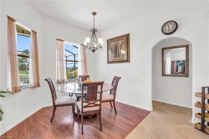 Tiled dining space with a notable chandelier