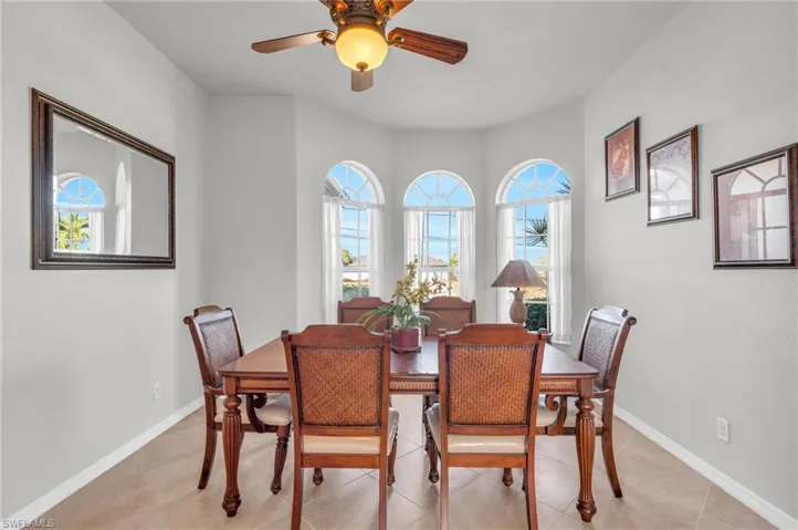 Tiled dining area with ceiling fan