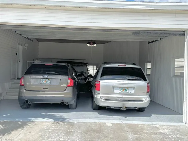 Huge garage with plenty of room to walk between and around cars.