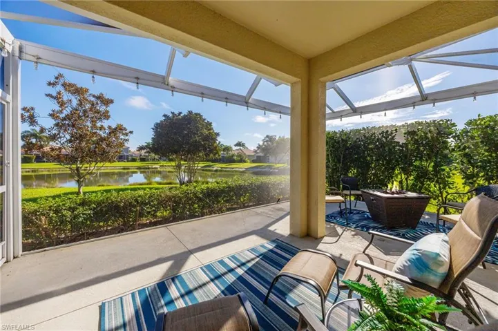 Picture window view over the lake and large yard