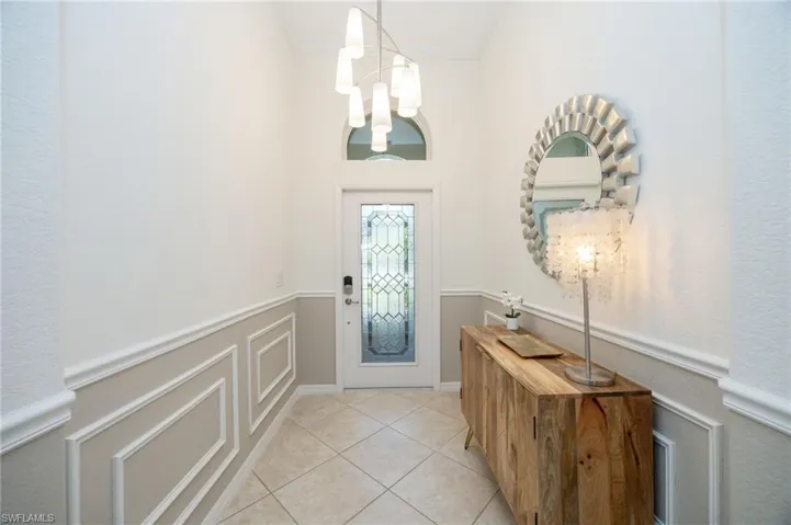 Beautiful glass insert door and arched transom window