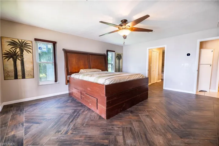 Bedroom featuring dark parquet floors and ceiling fan