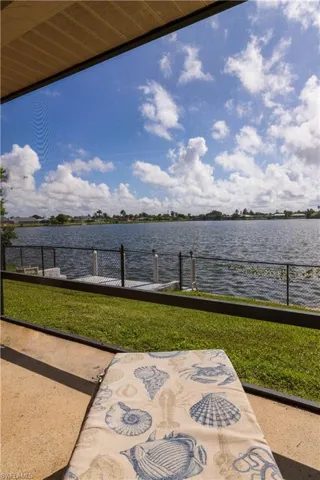 View of patio with a water view