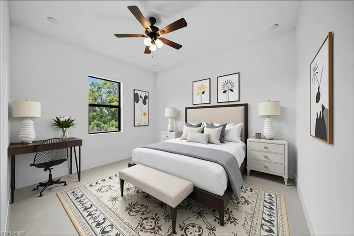 Bedroom with a ceiling fan and baseboards