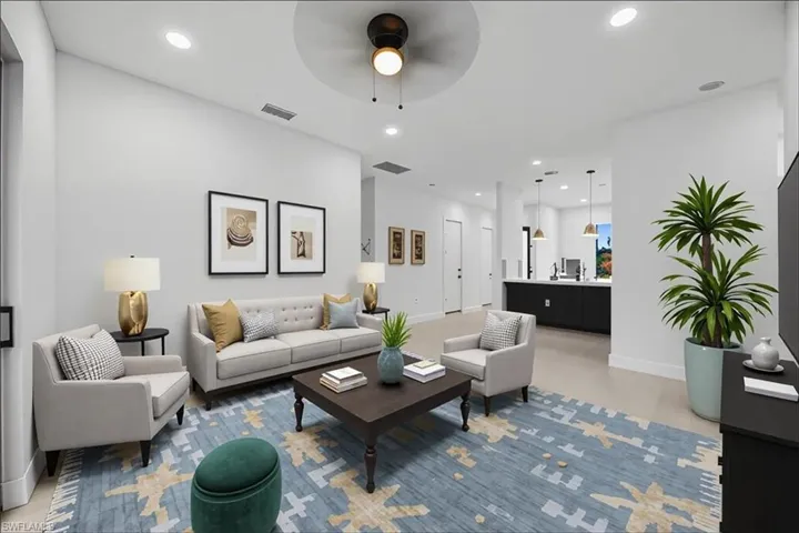 Living area featuring recessed lighting and ceiling fan