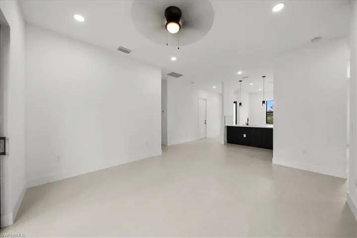 Unfurnished living room with recessed lighting and ceiling fan
