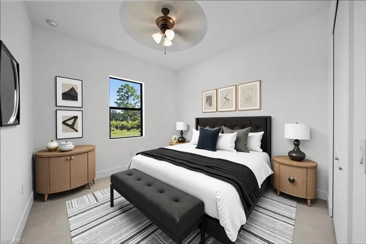 Bedroom featuring baseboards and ceiling fan