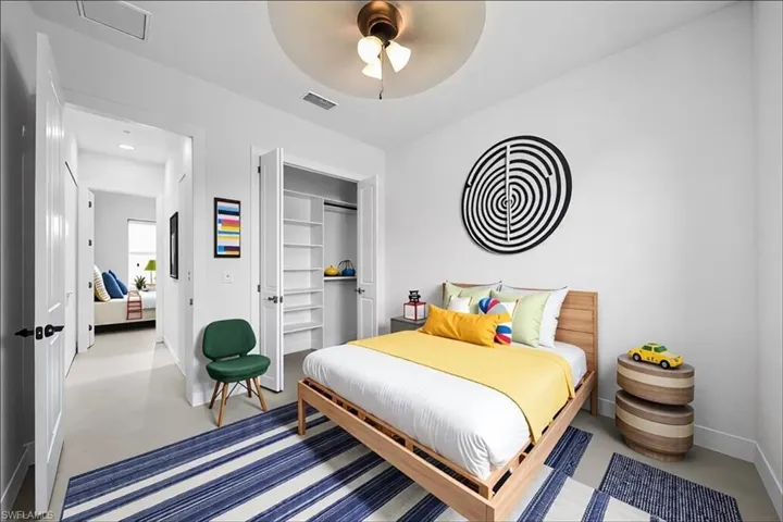 Bedroom featuring a closet and ceiling fan