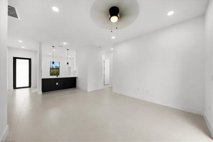 Unfurnished living room featuring recessed lighting, a ceiling fan, and light tile patterned flooring