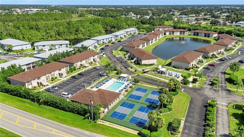 Aerial view of a nearby body of water and a pool area