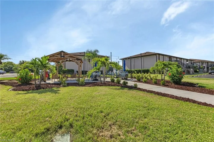View of green lawn featuring a gazebo
