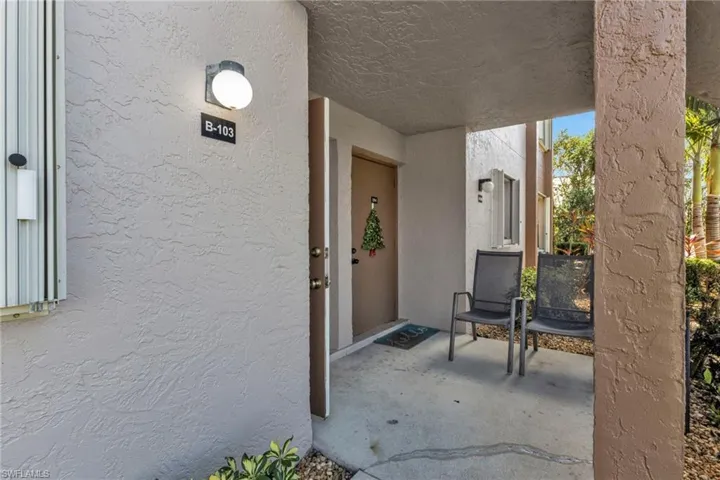 Doorway to property with stucco siding