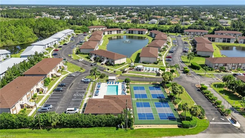 Aerial view of a nearby body of water and a pool area