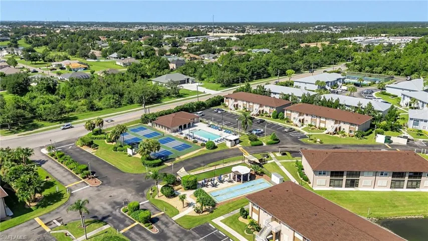 Aerial perspective of suburban area featuring a tree filled landscape