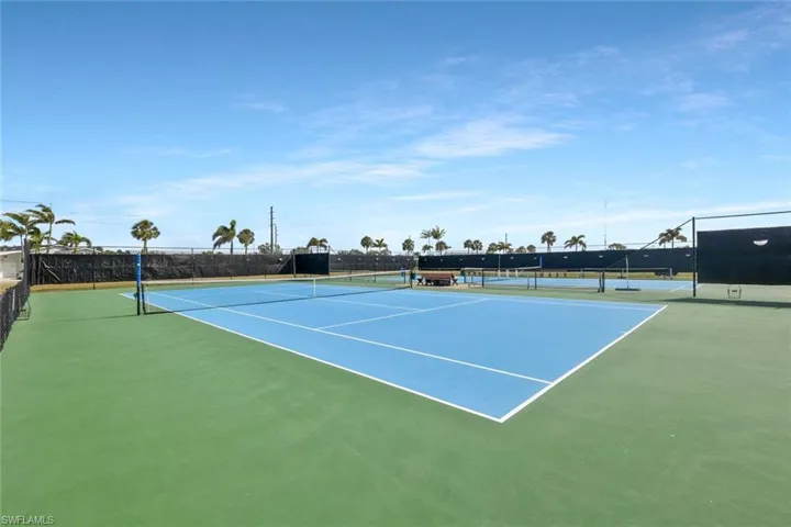 View of tennis court with fence