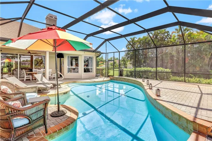 View of pool featuring a lanai and a patio