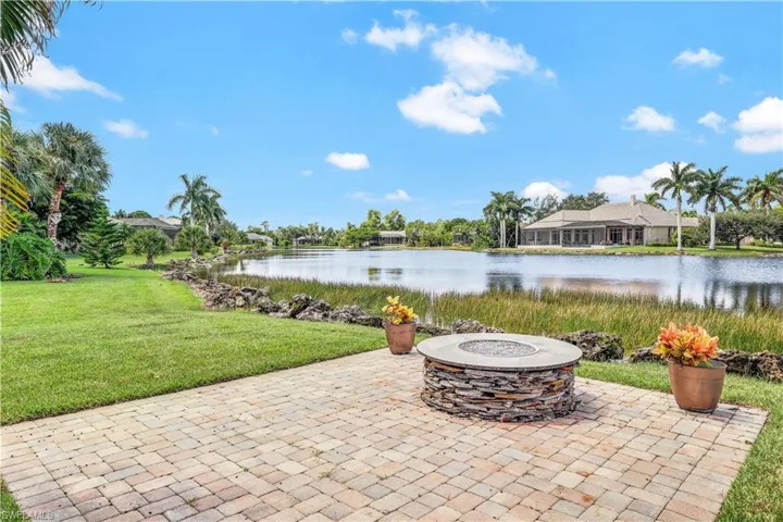 View of patio / terrace featuring a fire pit and a water view