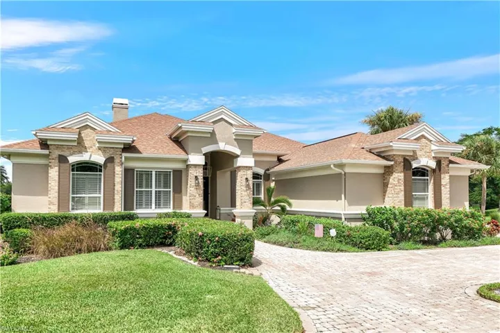 View of front of property with a front lawn