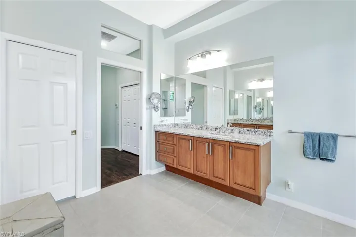 Bathroom featuring tile patterned flooring and vanity