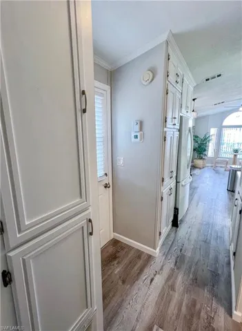 Hallway full of built-in storage cabinets