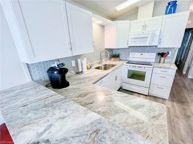 kitchen with beautiful granite counters and updated appliances