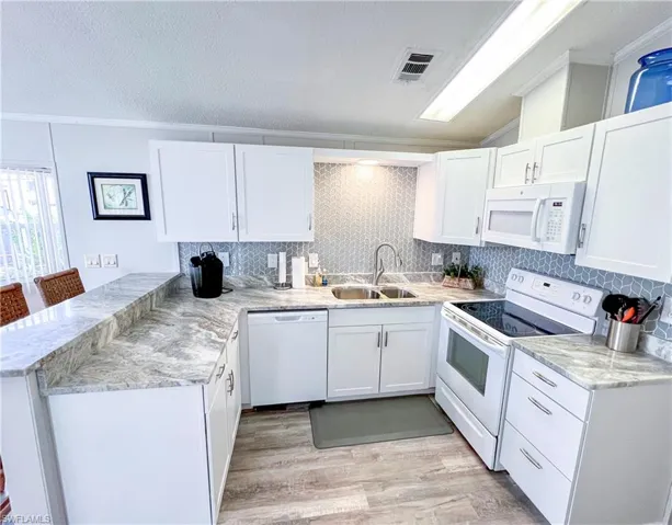 kitchen with beautiful granite counters and updated appliances