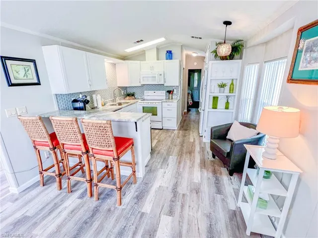 kitchen with beautiful granite counters and updated appliances