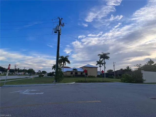 Curb cut leads into property from the adjacent Dollar General parking lot