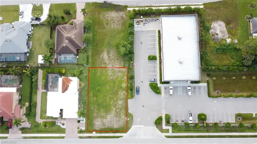 Curb cut leads to subject property from Dollar General next door parking