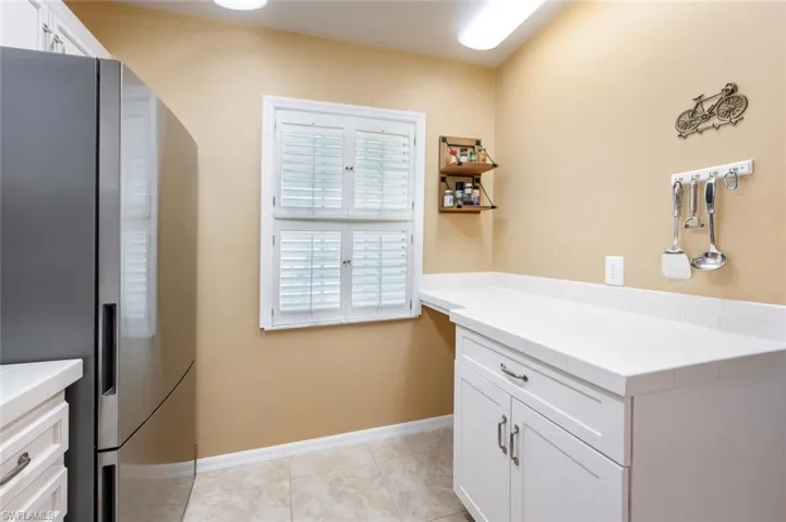 Kitchen with stainless steel appliances and white cabinets