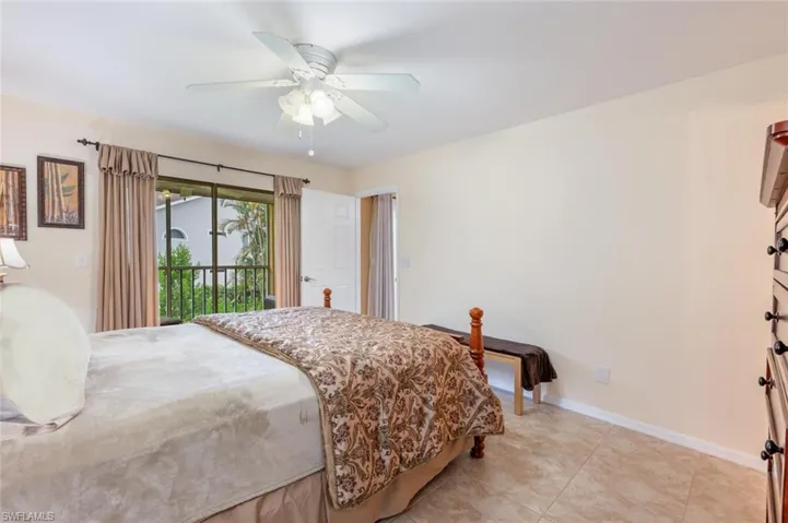 Tiled bedroom with access to outside