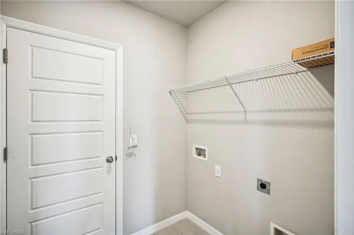 Laundry room with electric dryer hookup and hookup for a washing machine
