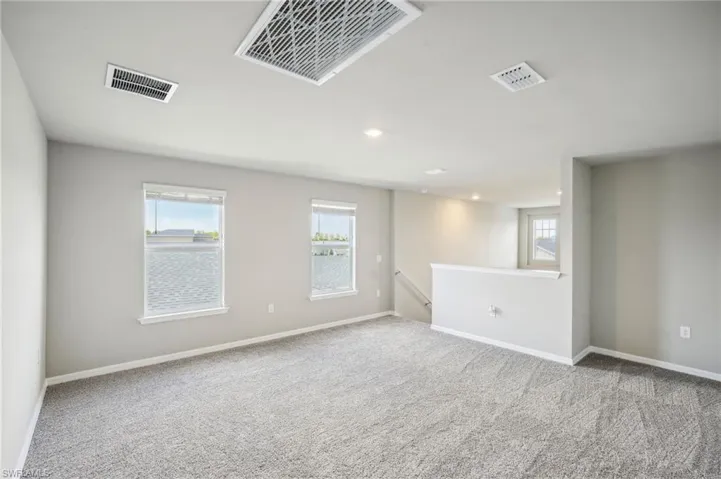 View of carpeted spare room