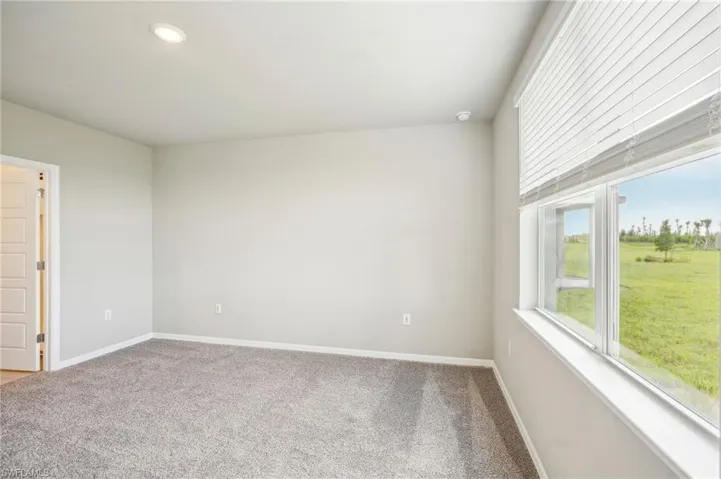 Spare room featuring carpet flooring