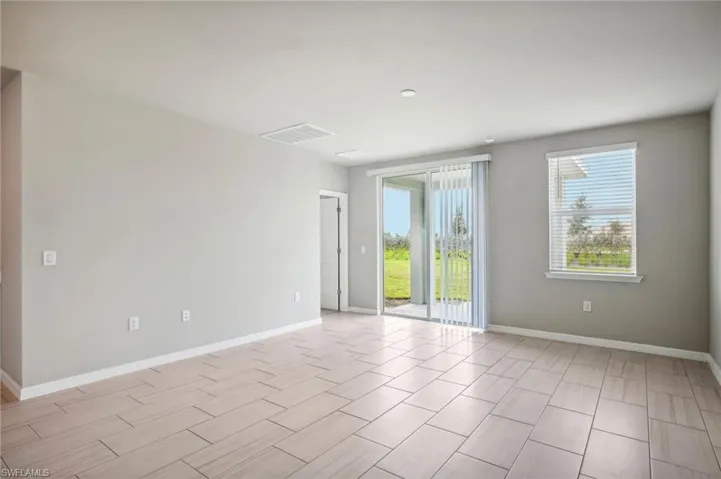 Empty room with light hardwood / wood-style floors