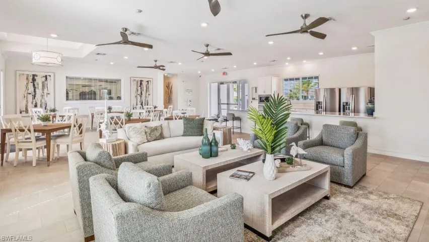 Spacious gathering area featuring recessed lighting, ceiling fans, and tiled flooring