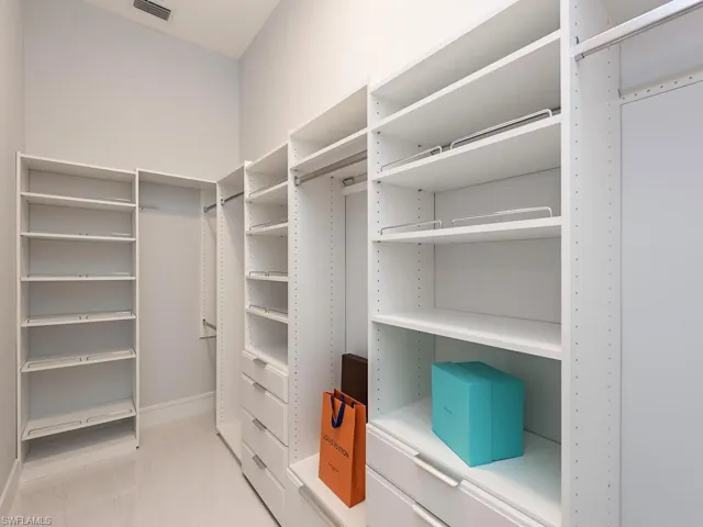 Spacious closet featuring visible vents and light tile patterned flooring